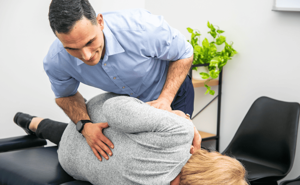 Geelong chiropractor performing manual adjustment to lower lumbar spine
